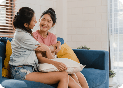 Two teenage girls embracing each other